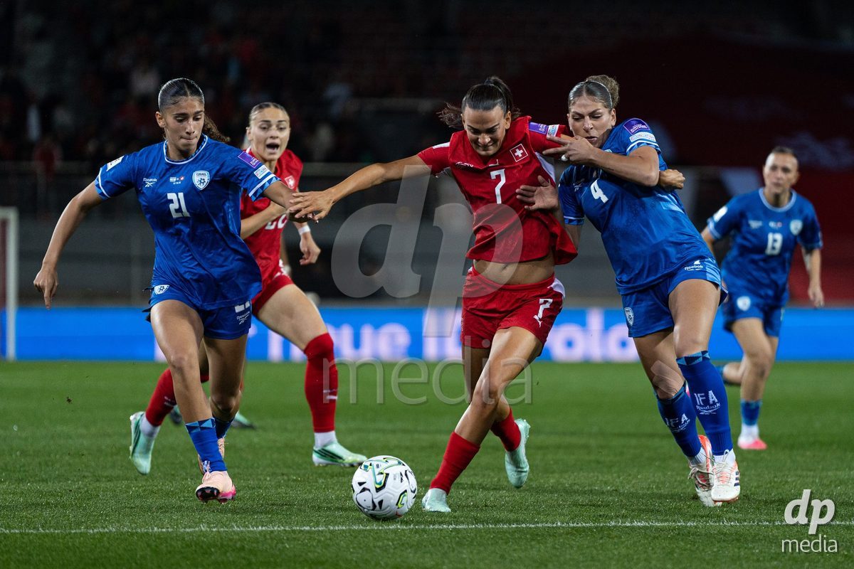 SION, SWITZERLAND, OCTOBER 13 : Duel between Riola Xhemaili of Switzerland and Itaf Alkisi of Israel during the FIFA Women's World Cup 2027 Women's European Qualifiers Play-offs game between Switzerland and Israel at Stade de Tourbillon on October 13, 2026 in Sion, Switzerland.