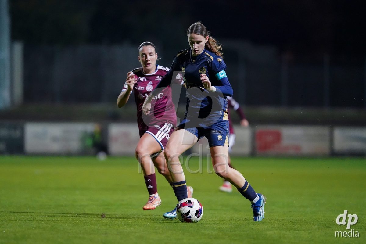GENEVA, SWITZERLAND - OCTOBER 16: Gloria Marinelli of Servette FC Chenois Feminin and Lena Walti of FC Luzern battle for the ball during the AXA Women's Super League match between Servette FC Chenois Feminin and FC Luzern at Stade de Trois-Chene on October 16, 2026 in Geneva, Switzerland.