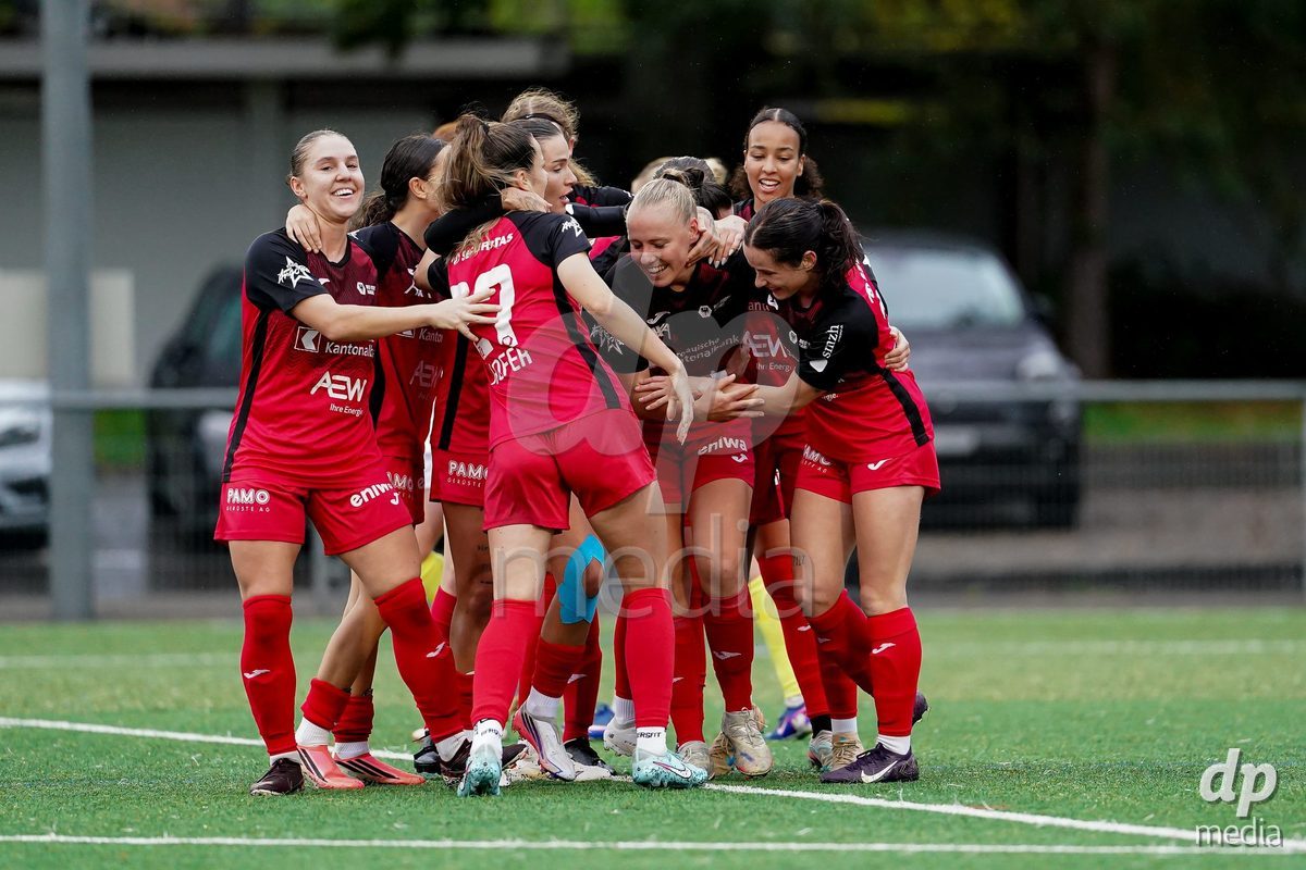 AARAU, SWITZERLAND - OCTOBER 17: Michelle Stierli of FC Aarau Frauen celebrating with team after scoring teams first goal during the AXA Women's Super League match between FC Aarau Frauen and FC Basel 1893 at Sportanlage Schachen on October 17, 2026 in Aarau, Switzerland.