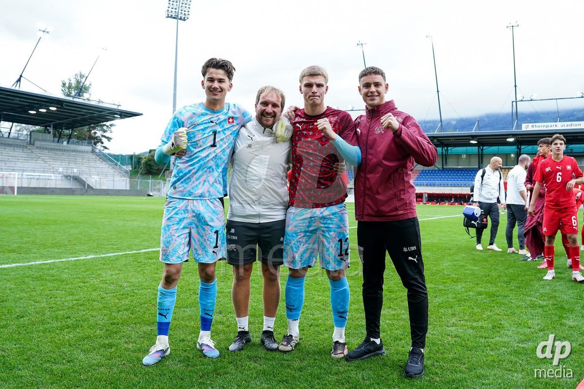 VADUZ, LIECHTENSTEIN - OCTOBER 18: Yanis Emch, goalkeeper coach Josua Bonvin, Henrik Fehr and Lucas Lorenzon of Switzerland celebrate their victory after the UEFA European Under-17 Qualifier match between Switzerland and Spain at Rheinpark Stadion on October 18, 2026 in Vaduz, Liechtenstein.