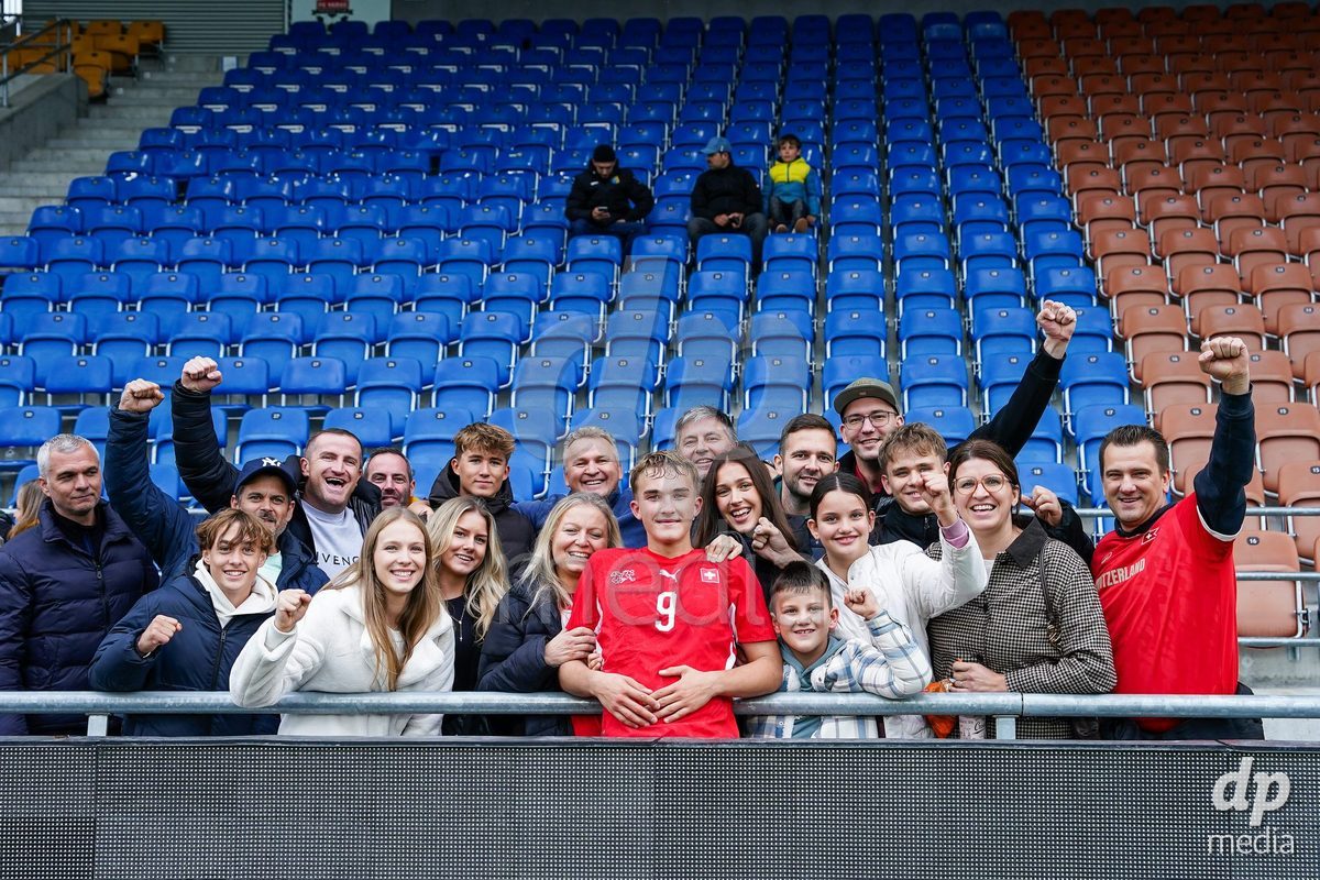 VADUZ, LIECHTENSTEIN - OCTOBER 18: Niko Cavka of Switzerland with family and friends after the victory during the UEFA European Under-17 Qualifier match between Switzerland and Spain at Rheinpark Stadion on October 18, 2026 in Vaduz, Liechtenstein.