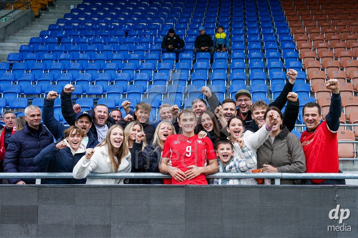 VADUZ, LIECHTENSTEIN - OCTOBER 18: Niko Cavka of Switzerland with family and friends after the victory during the UEFA European Under-17 Qualifier match between Switzerland and Spain at Rheinpark Stadion on October 18, 2026 in Vaduz, Liechtenstein.