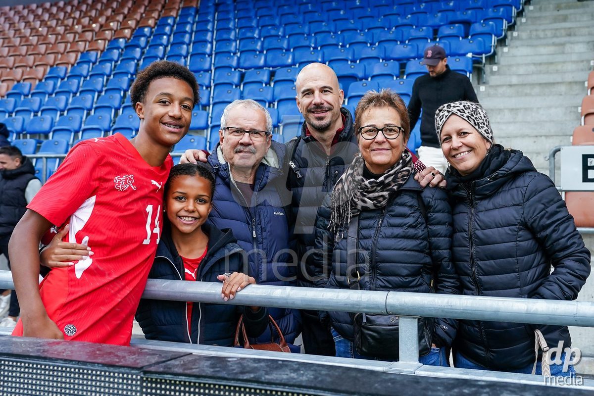 VADUZ, LIECHTENSTEIN - OCTOBER 18: Ryan Hare of Switzerland celebrates after the victory and poses for a photo with family and friends during the UEFA European Under-17 Qualifier match between Switzerland and Spain at Rheinpark Stadion on October 18, 2026 in Vaduz, Liechtenstein.