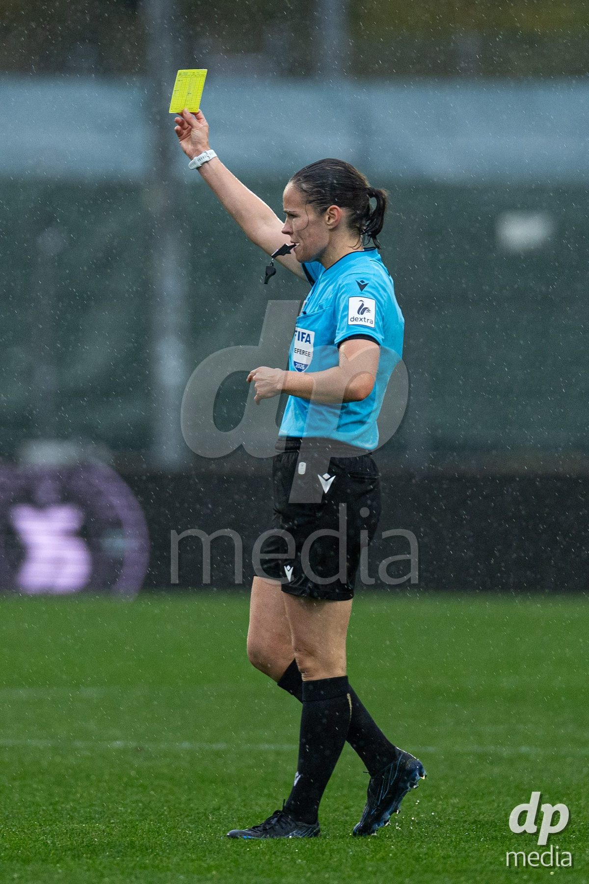 YVERDON-LES-BAINS, SWITZERLAND - OCTOBER 18: Referee Deborah Anex gives a yellow card during the AXA Women's Super League match between FC Yverdon Women and FC Rapperswil-Jona at Stade Municipal on October 18, 2026 in Yverdon-les-Bains, Switzerland.