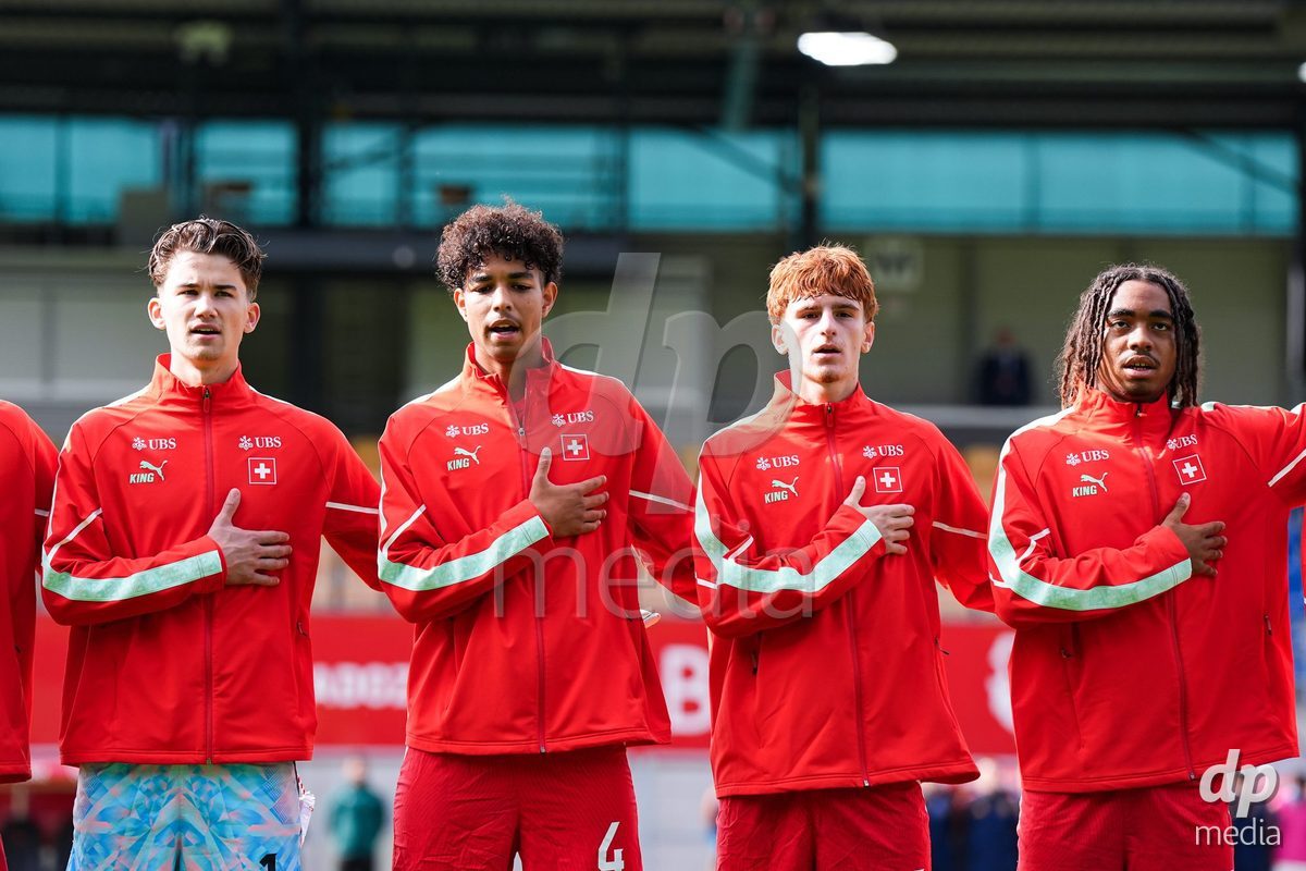 VADUZ, LIECHTENSTEIN - OCTOBER 18: Yanis Emch, Ifeanyichukwu Onwuzulike and Eron Kele and Leon White of Switzerland during the national anthem prior to the UEFA European Under-17 Qualifier match between Switzerland and Spain at Rheinpark Stadion on October 18, 2026 in Vaduz, Liechtenstein.