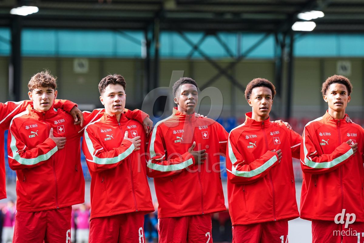 VADUZ, LIECHTENSTEIN - OCTOBER 18: Niklas Zuger, Leandro Cottiati, Darren Okoh, Ryan Hare and Kyle Kurt of Switzerland during the national anthem prior to the UEFA European Under-17 Qualifier match between Switzerland and Spain at Rheinpark Stadion on October 18, 2026 in Vaduz, Liechtenstein.