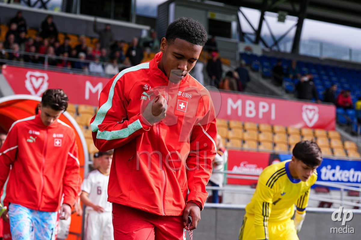 VADUZ, LIECHTENSTEIN - OCTOBER 18: Noah Kakor of Switzerland enters for the natioanl anthem prior to the UEFA European Under-17 Qualifier match between Switzerland and Spain at Rheinpark Stadion on October 18, 2026 in Vaduz, Liechtenstein.