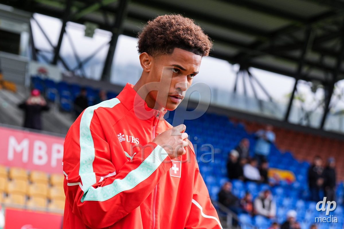 VADUZ, LIECHTENSTEIN - OCTOBER 18: Kyle Kurt of Switzerland enters for the natioanl anthem prior to the UEFA European Under-17 Qualifier match between Switzerland and Spain at Rheinpark Stadion on October 18, 2026 in Vaduz, Liechtenstein.