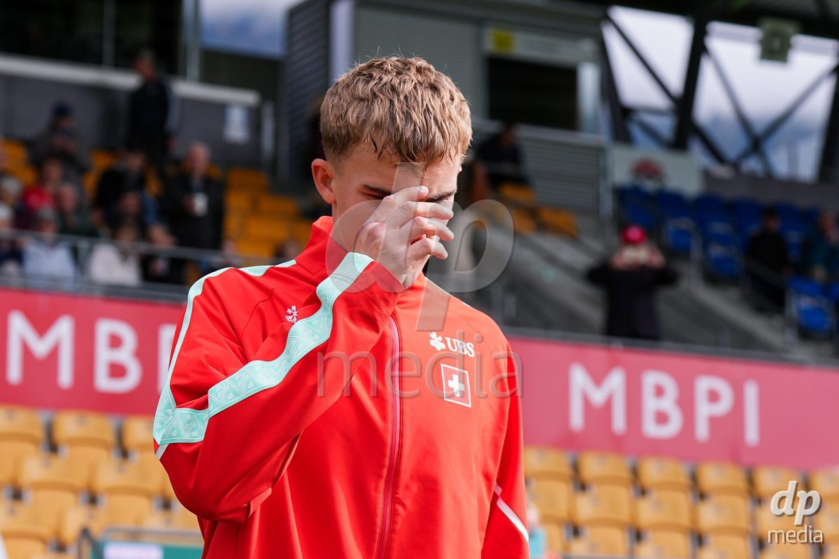 VADUZ, LIECHTENSTEIN - OCTOBER 18: Niko Cavka of Switzerland enters for the natioanl anthem prior to the UEFA European Under-17 Qualifier match between Switzerland and Spain at Rheinpark Stadion on October 18, 2026 in Vaduz, Liechtenstein.