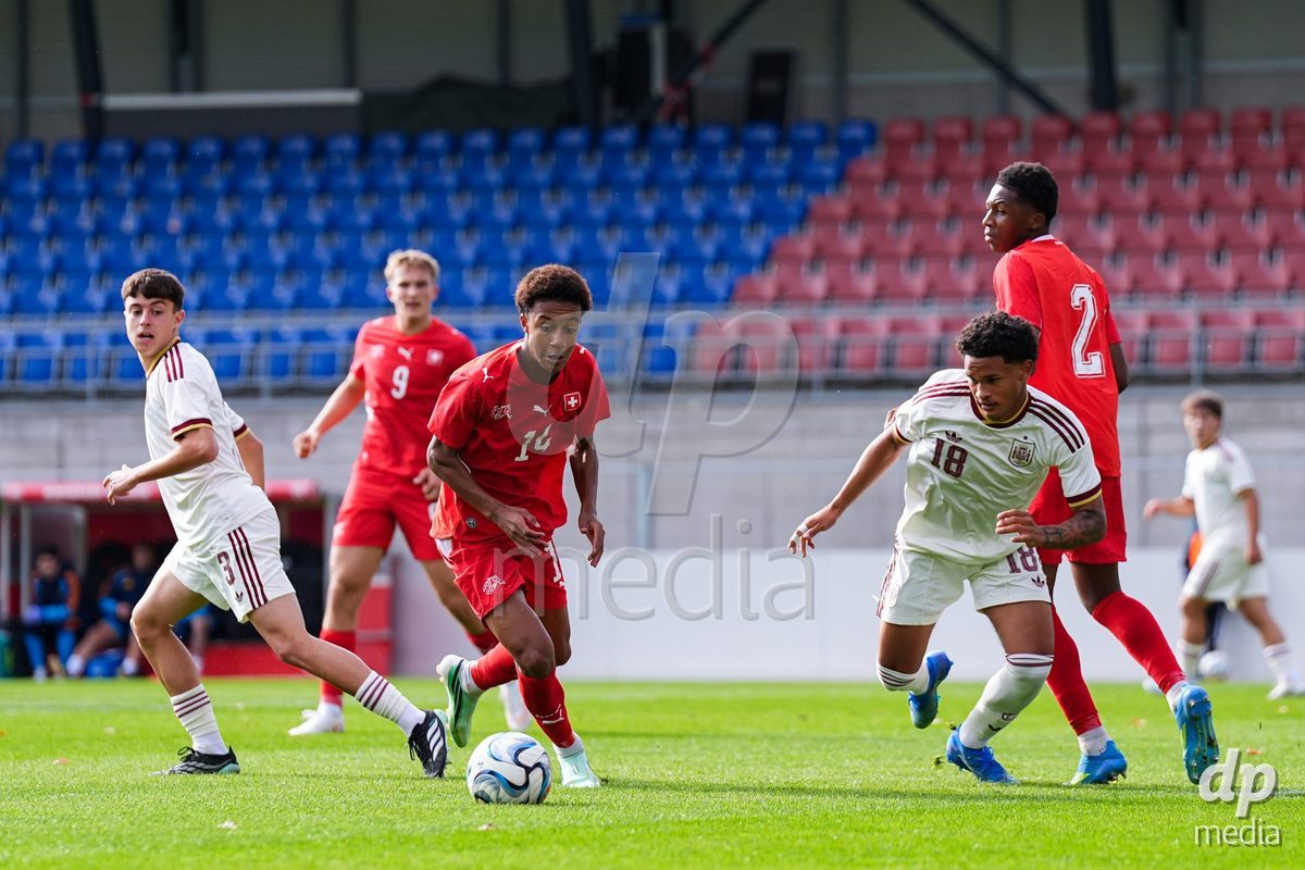 VADUZ, LIECHTENSTEIN - OCTOBER 18: Ryan Hare of Switzerland battles for the ball during the UEFA European Under-17 Qualifier match between Switzerland and Spain at Rheinpark Stadion on October 18, 2026 in Vaduz, Liechtenstein.