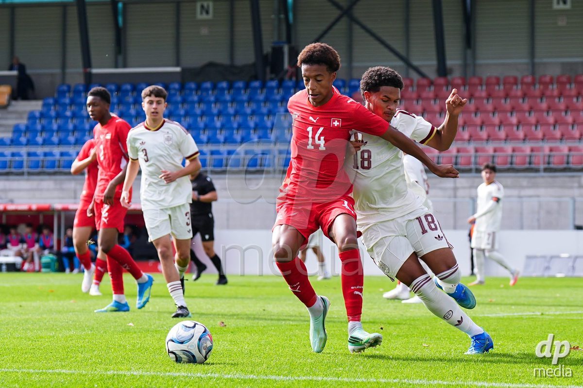 VADUZ, LIECHTENSTEIN - OCTOBER 18: Ryan Hare of Switzerland battles for the ball against Darek Barriento of Spain during the UEFA European Under-17 Qualifier match between Switzerland and Spain at Rheinpark Stadion on October 18, 2026 in Vaduz, Liechtenstein.