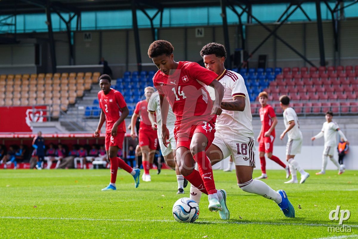 VADUZ, LIECHTENSTEIN - OCTOBER 18: Ryan Hare of Switzerland battles for the ball against Darek Barriento of Spain during the UEFA European Under-17 Qualifier match between Switzerland and Spain at Rheinpark Stadion on October 18, 2026 in Vaduz, Liechtenstein.