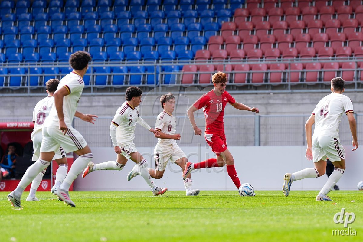 VADUZ, LIECHTENSTEIN - OCTOBER 18: Eron Kele of Switzerland (surrounded) battles for the ball during the UEFA European Under-17 Qualifier match between Switzerland and Spain at Rheinpark Stadion on October 18, 2026 in Vaduz, Liechtenstein.
