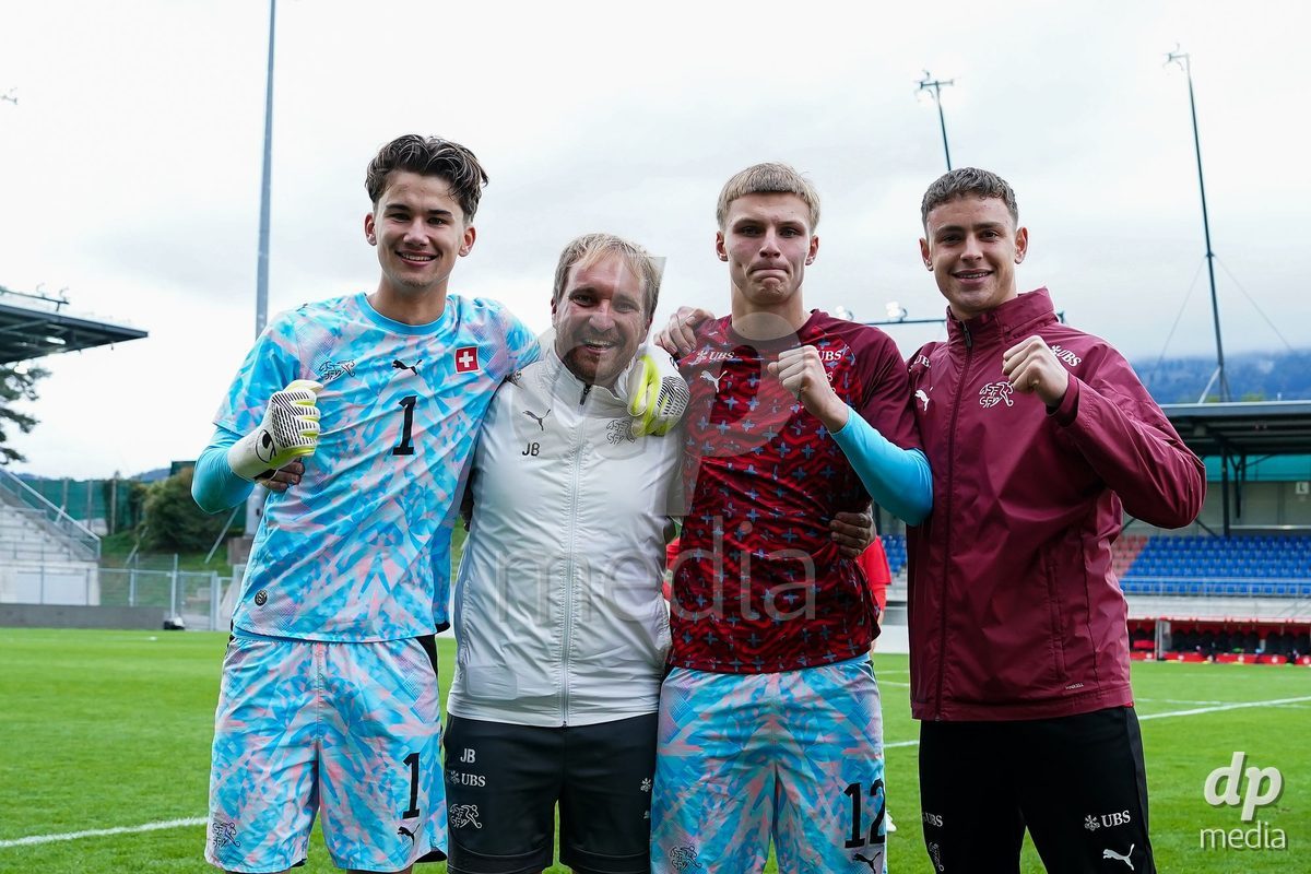 VADUZ, LIECHTENSTEIN - OCTOBER 18: Yanis Emch, goalkeeper coach Josua Bonvin, Henrik Fehr and Lucas Lorenzon of Switzerland celebrate their victory after the UEFA European Under-17 Qualifier match between Switzerland and Spain at Rheinpark Stadion on October 18, 2026 in Vaduz, Liechtenstein.