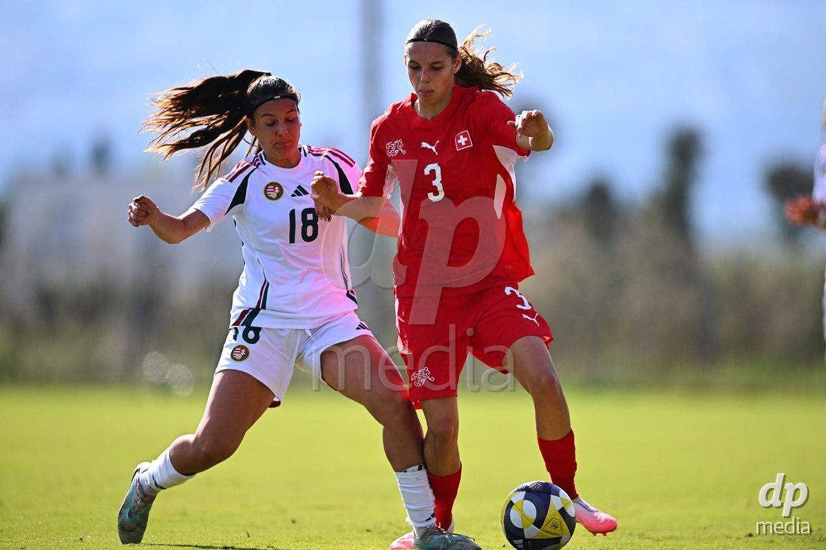 OLIVA NOVA, SPAIN - OCTOBER 22: Louise Schule of Switzerland competes for the ball with Virag Sipos-Kiss of Hungary during the International Women's Friendly match between Hungary U17 and Switzerland U17 at Oliva Nova Sports Center on October 22, 2026 in Oliva Nova, Spain.