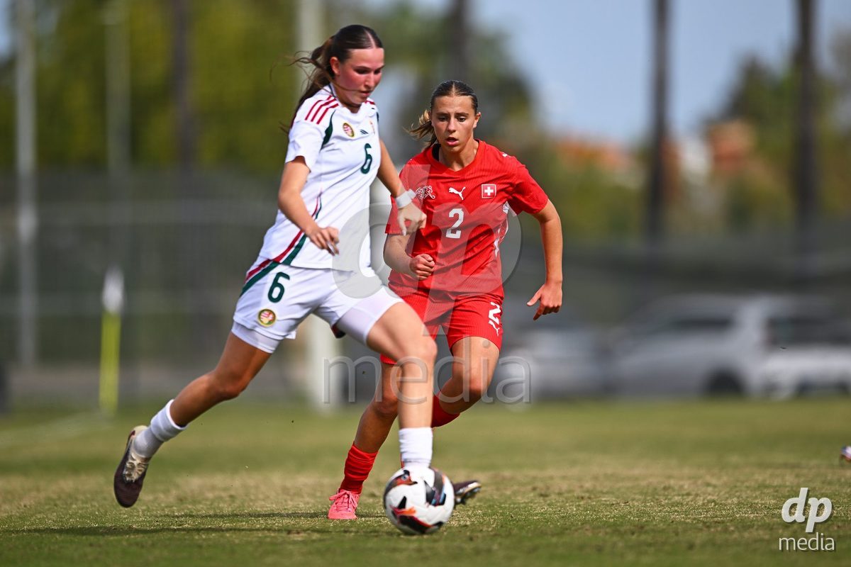 OLIVA NOVA, SPAIN - OCTOBER 24: Bigna Godenzi of Switzerland competes for the ball with Boglarka Tramontini of Hungary during the International Women's Friendly match between Switzerland U17 and Hungary U17 at Oliva Nova Sports Center on October 24, 2026 in Oliva Nova, Spain.
