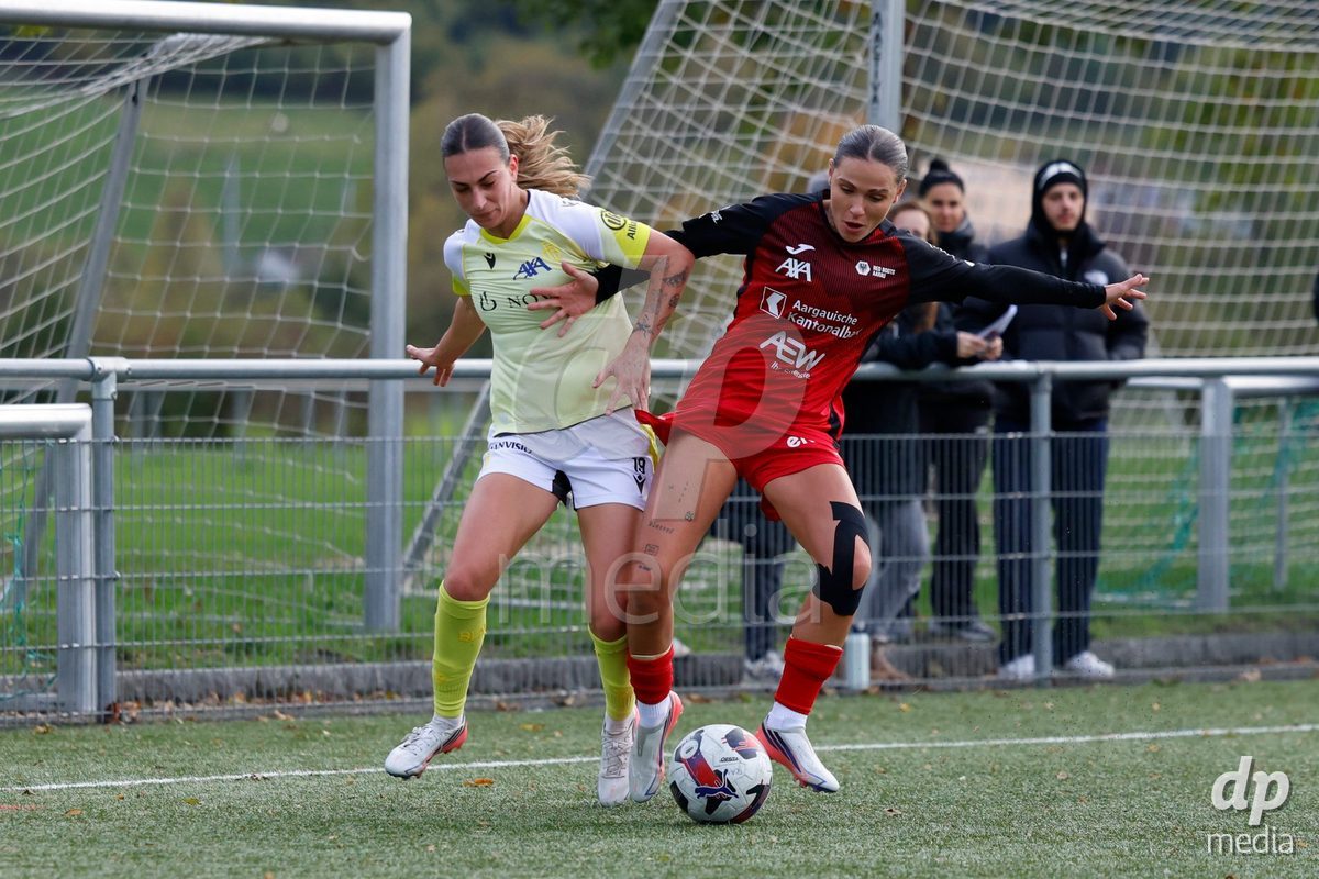 AARAU, SWITZERLAND - OCTOBER 24: Vanesa Hoti of FC Aarau Frauen (R) and Alice Berti of FC Basel 1893 fighting for the ball during the AXA Women's Cup match between FC Aarau Frauen and FC Basel 1893 at Sportanlage Schachen on October 24, 2026 in Aarau, Switzerland.