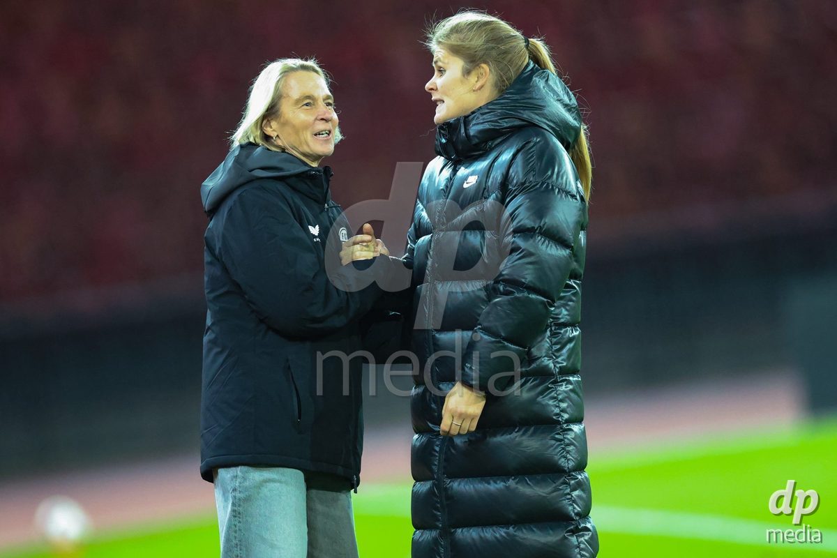 ZURICH, SWITZERLAND - OCTOBER 24: Martina Voss-Tecklenburg (Head Coach, FC Zürich Frauen) (L) congratulated on advancing to the next round of the cup Imke Wübbenhorst (Head Coach, BSC YB Frauen) during the AXA Women's Cup match between FC Zurich and BSC YB Frauen at Letzigrund on October 24, 2026 in Zurich, Switzerland.