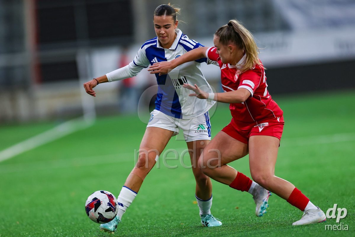 THUN, SWITZERLAND - OCTOBER 25: Emma Egli from the GC Frauenfussball (L) challenge for the ball with Rilana Ueltschi from FC Thun Frauen during the AXA Women's Cup match between FC Thun and GC Frauenfussball at Visana Stadion on October 25, 2026 in Thun, Switzerland.