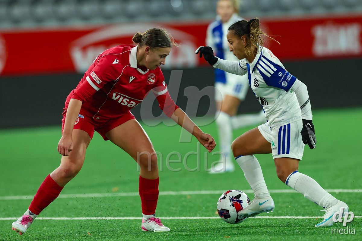 THUN, SWITZERLAND - OCTOBER 25: Dalila Belen Ippolito from the GC Frauenfussball (R) challenging for the ball against Lauriane Frei from the FC Thun Frauen during the AXA Women's Cup match between FC Thun and GC Frauenfussball at Visana Stadion on October 25, 2026 in Thun, Switzerland.