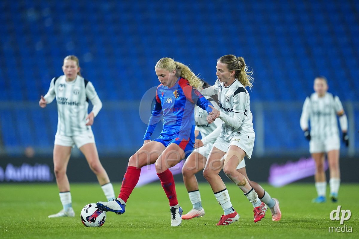 BASEL, SWITZERLAND - OCTOBER 30: Jacqueline Anne Hand of FC Basel 1893 (L) and Kim Dubs of FC Zurich (R) battle for the ball (duel) during the AXA Women's Super League match between FC Basel 1893 and FC Zurich at St. Jakob-Park on October 30, 2026 in Basel, Switzerland.